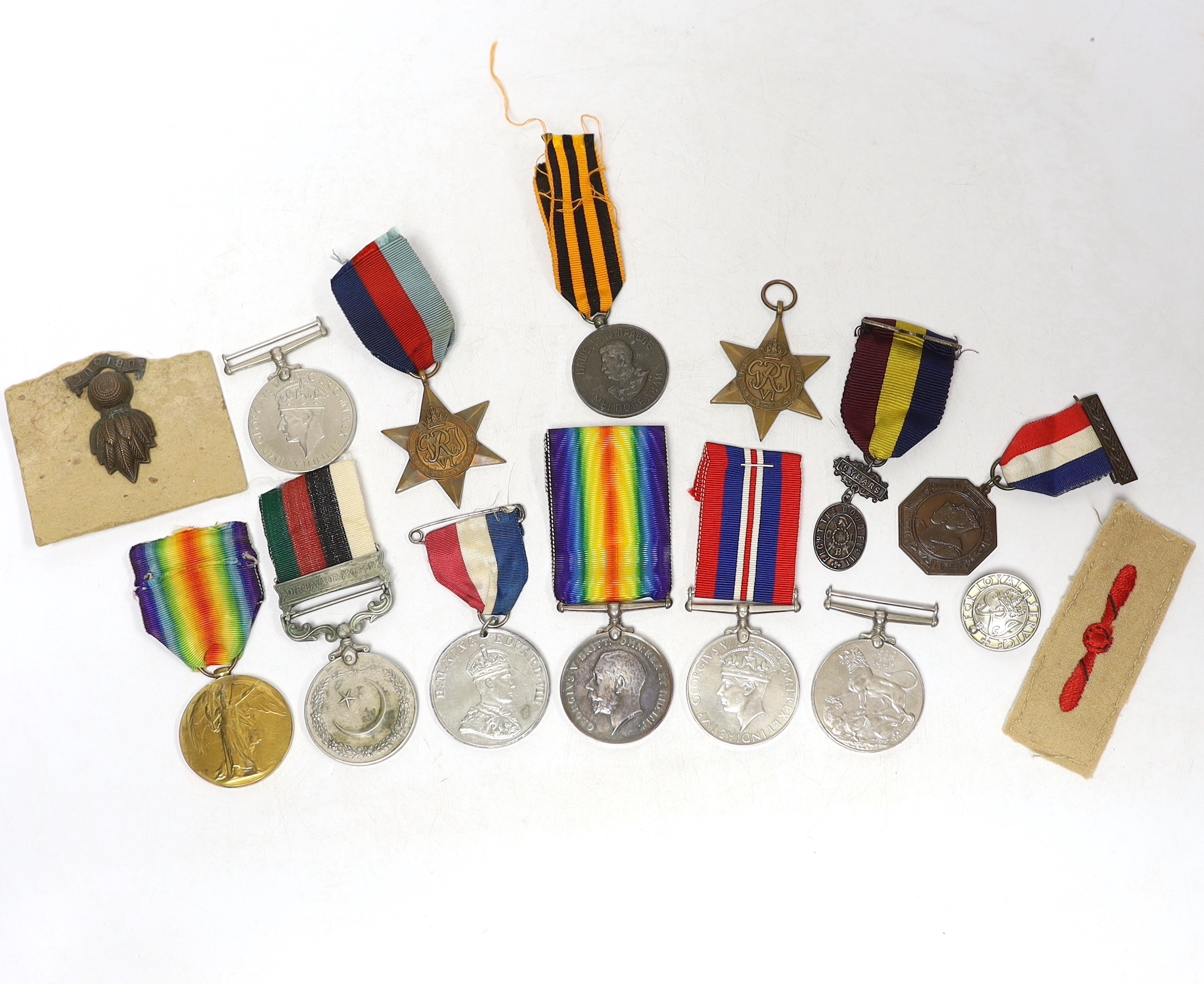 Twelve medals including; a British War Medal, a Victory Medal, three 1939-45 War Medals, two 1939-45 Stars, an Edward VIII Coronation Medal, a Soviet Stalin Victory medal, a Pakistan General Service Medal, a George VI Co